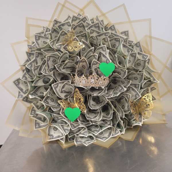 Bouquet made of folded dollar bills with gold butterfly accents