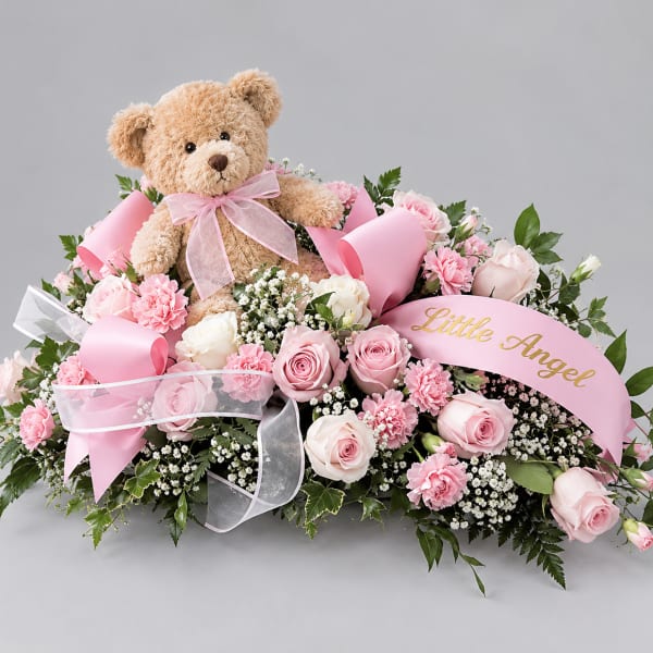 Pink rose arrangement with a teddy bear and ribbon banner