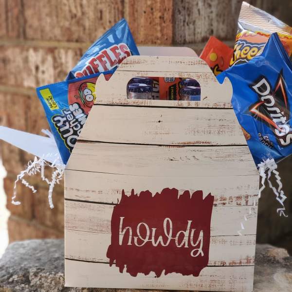 Wooden gift box with assorted snack bags and candy