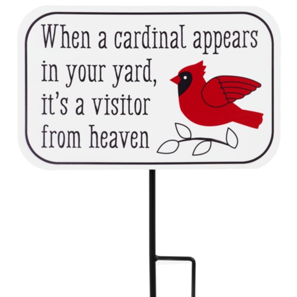 Yard sign with a red cardinal and memorial text