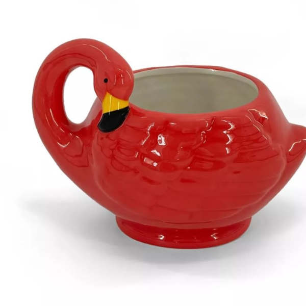 Red flamingo-shaped ceramic planter with an open top