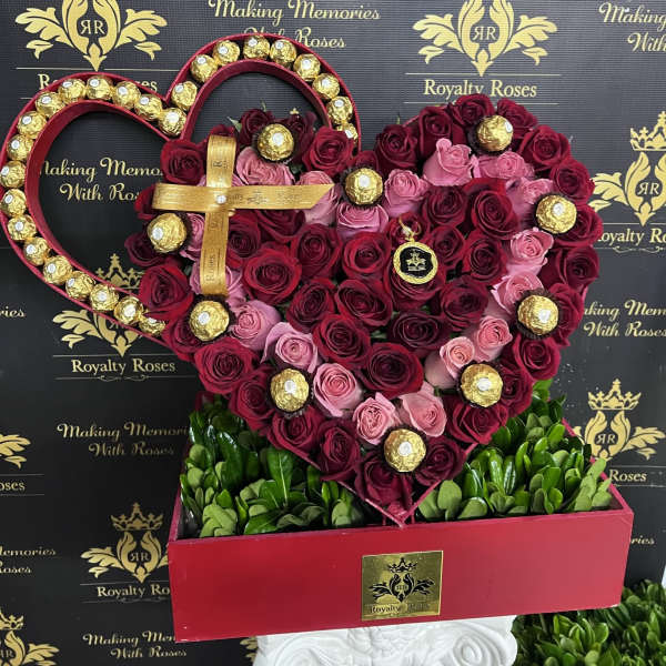 Heart-shaped rose arrangement with gold-wrapped chocolates in a red box