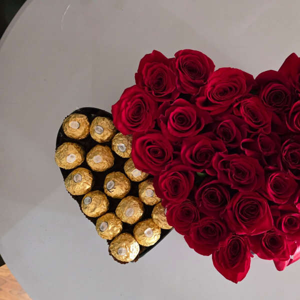 Heart-shaped rose arrangement with Ferrero Rocher chocolates and a small crown