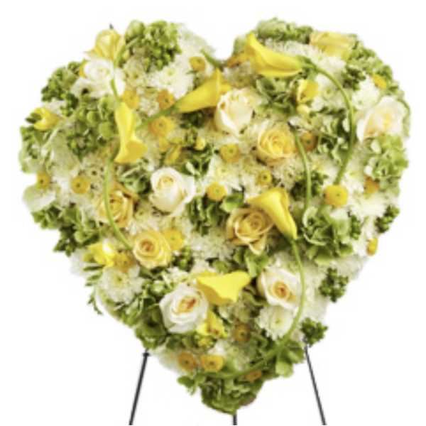 Heart-shaped floral spray with yellow and white flowers