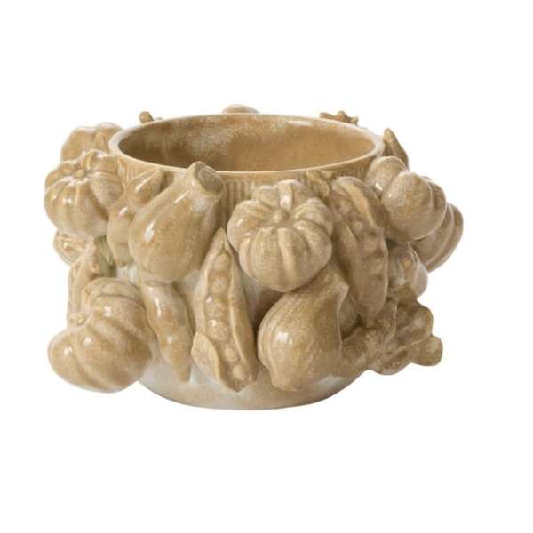 Beige ceramic bowl with raised pumpkin shapes around the outside