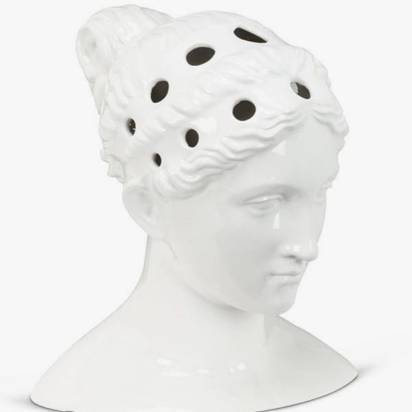 White decorative bust with a perforated sculpted headpiece
