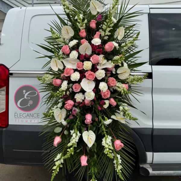 Large standing floral spray with pink roses and white anthuriums