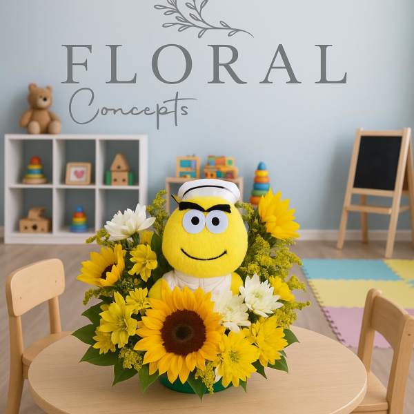 Sunflower and daisy arrangement with a yellow plush character centerpiece