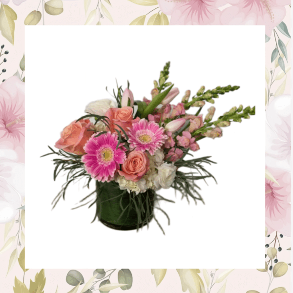Pink and peach mixed bouquet in a dark green vase