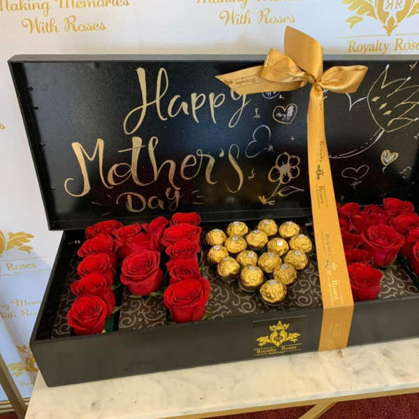 Black gift box with red roses and gold-wrapped chocolates for Mother's Day