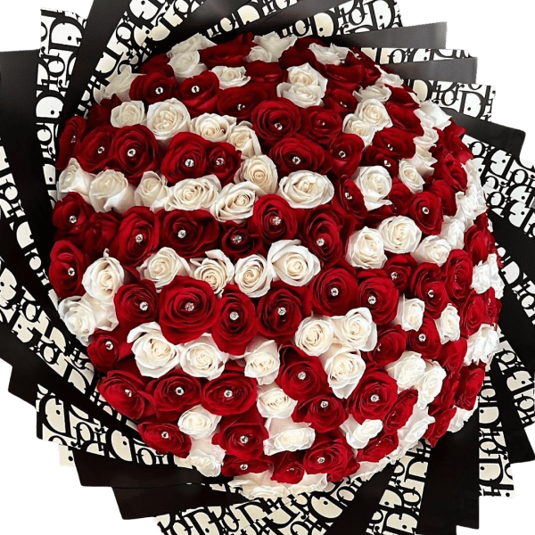 Round bouquet of red and white roses with black patterned wrapping
