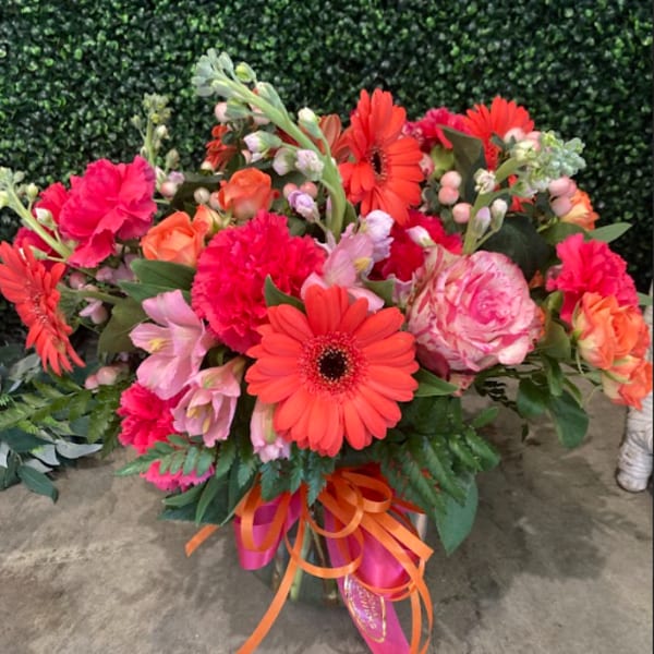 Bright mixed bouquet with orange gerbera daisies and pink flowers