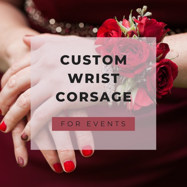 Red rose wrist corsage on a hand