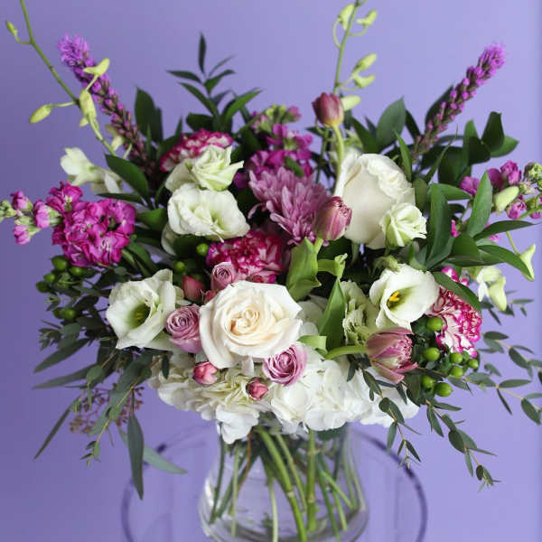 Mixed pink and white bouquet in a clear glass vase