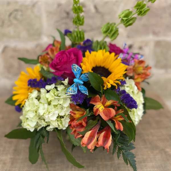 Colorful bouquet with sunflowers, roses, hydrangeas, and orange lilies