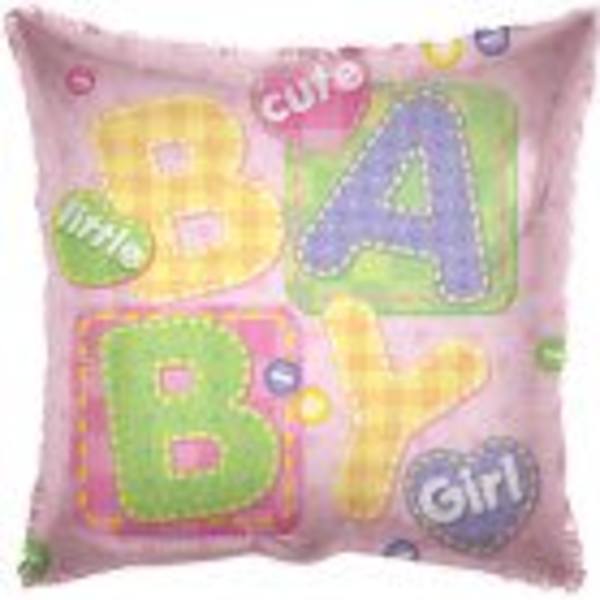 Pink pillow with colorful letters spelling BABY