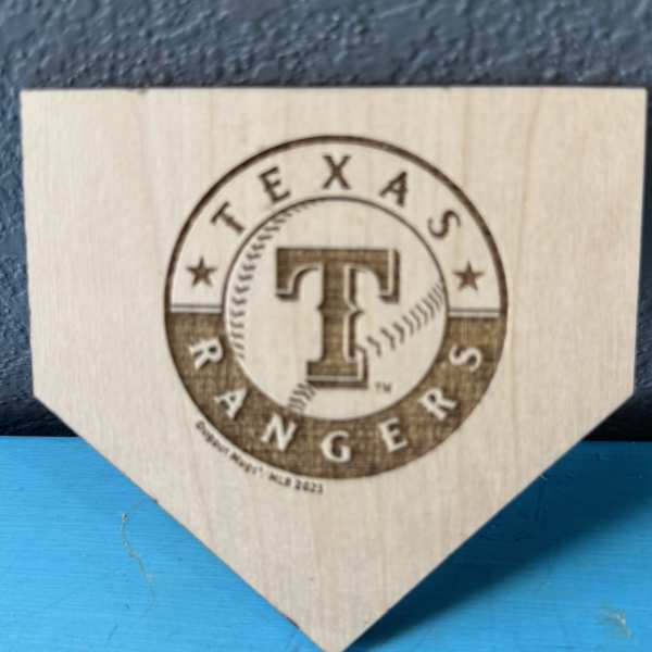 Texas Rangers logo on a wooden plaque