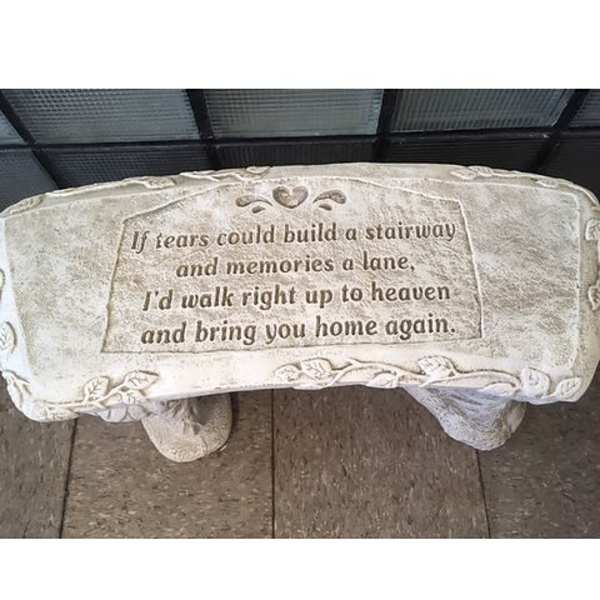 Memorial stone with an engraved sympathy verse