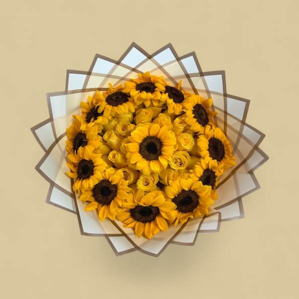 Bouquet of yellow sunflowers and roses wrapped in layered paper