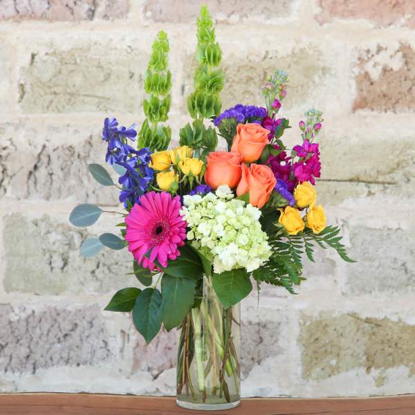 Colorful mixed bouquet in a clear glass vase