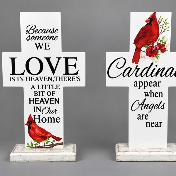 Two white memorial cross signs with cardinal and sympathy text