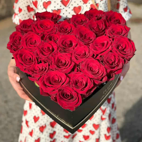 Heart-shaped box filled with red roses