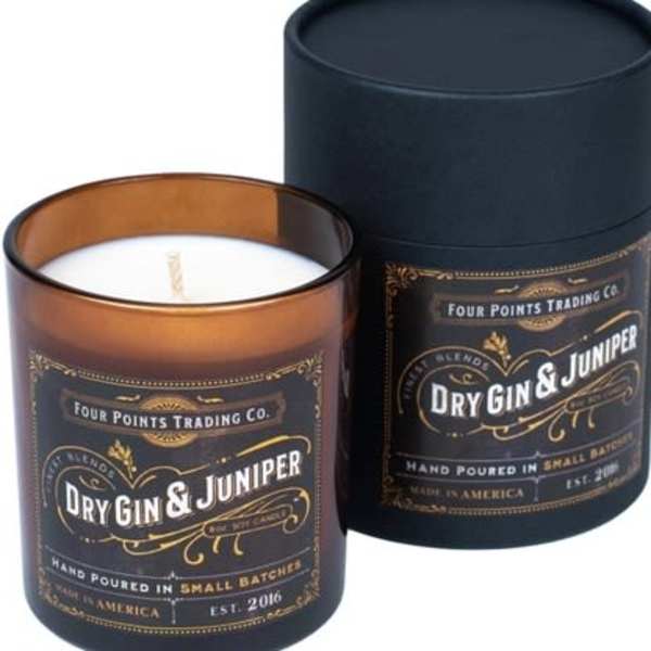 Two scented candles in dark glass jars with black labels