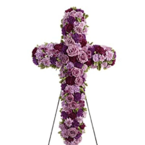 Purple and pink floral cross on a stand