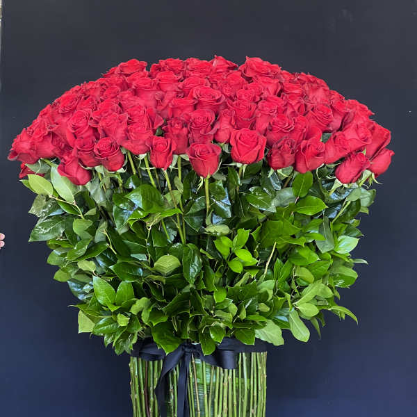 Large bouquet of red roses with a black ribbon wrap