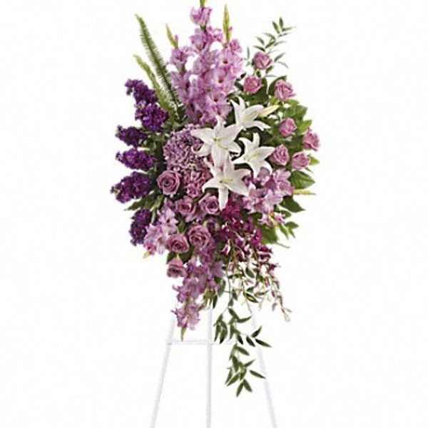 Tall purple and white floral spray on a stand