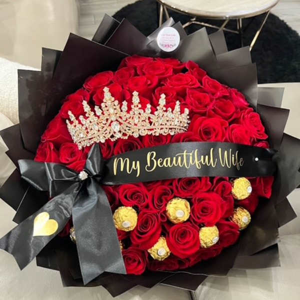 Bouquet of red roses with a tiara and black ribbon