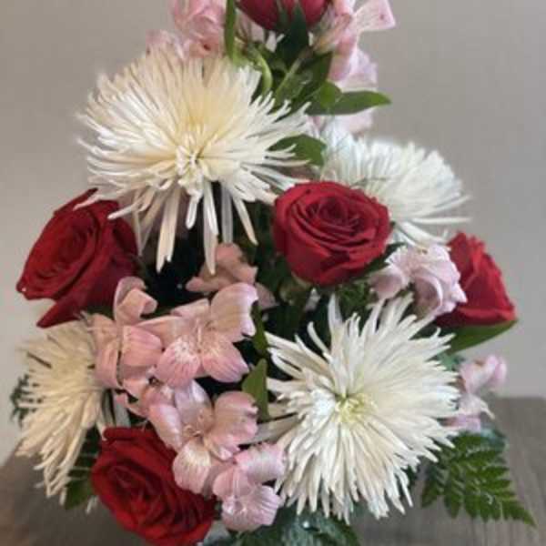 Red roses and white spider mums with pink filler flowers