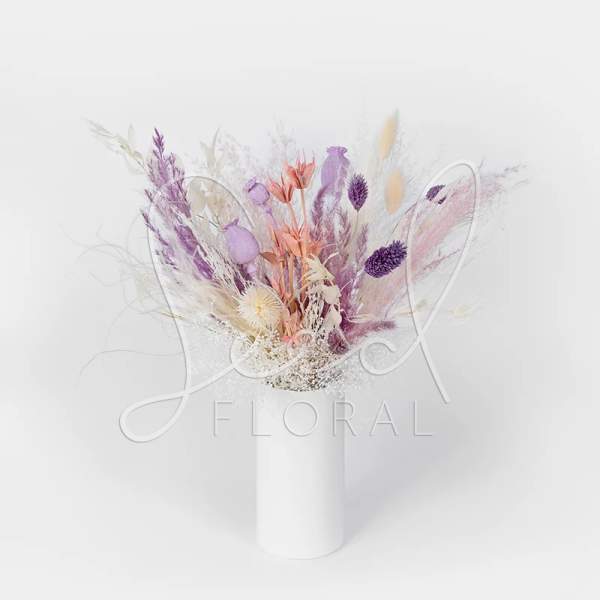 Pastel dried flower arrangement in a white vase