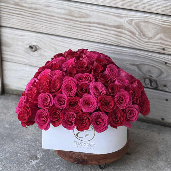 Large dome of hot pink roses in a white box