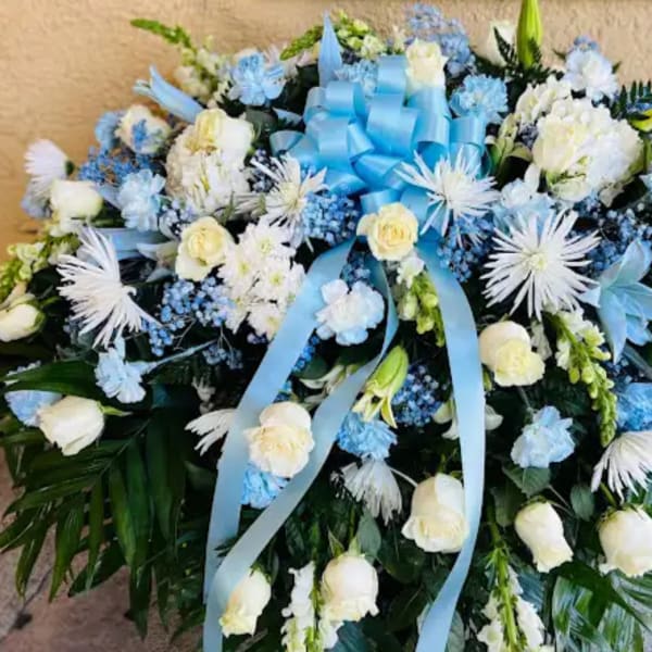 Baby blue & white sympathy casket Spray
