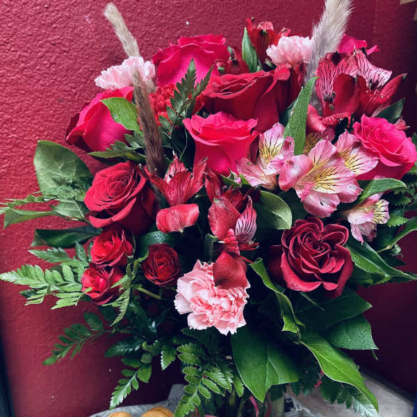 Red rose bouquet with pink alstroemeria and carnations, plus macarons and chocolate-covered strawberries