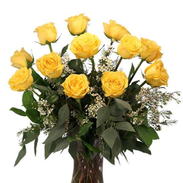 Yellow roses arranged in a clear glass vase