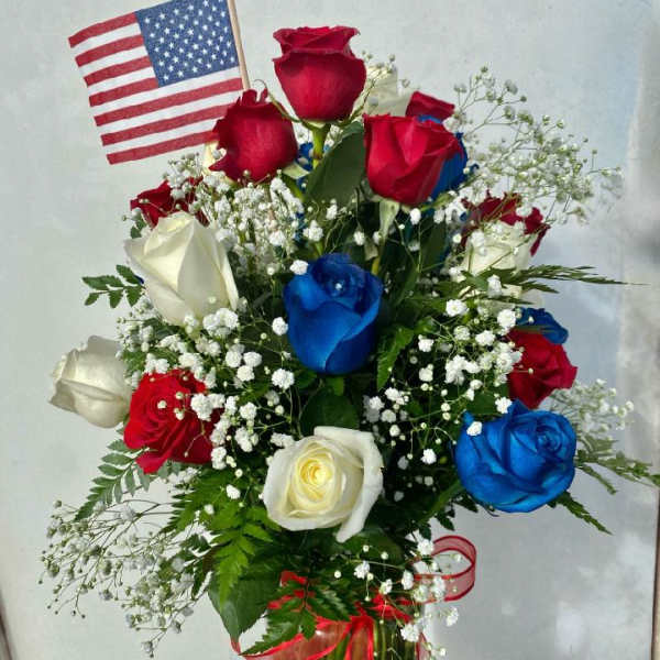 Bouquet of red, white, and blue roses with a small American flag
