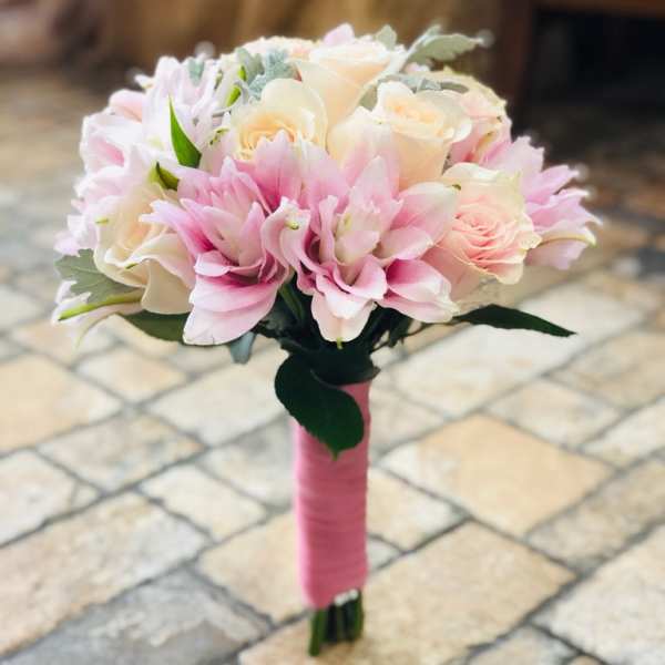 Pink and white bridal bouquet with roses and lilies
