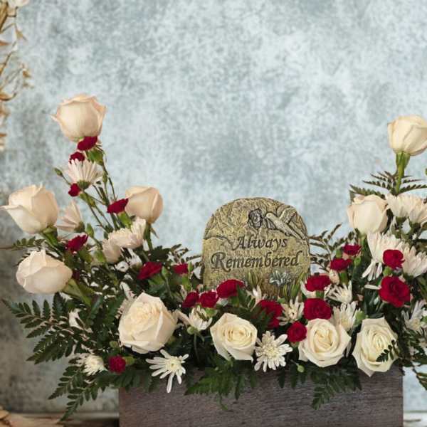 White and red rose arrangement with a memorial stone centerpiece