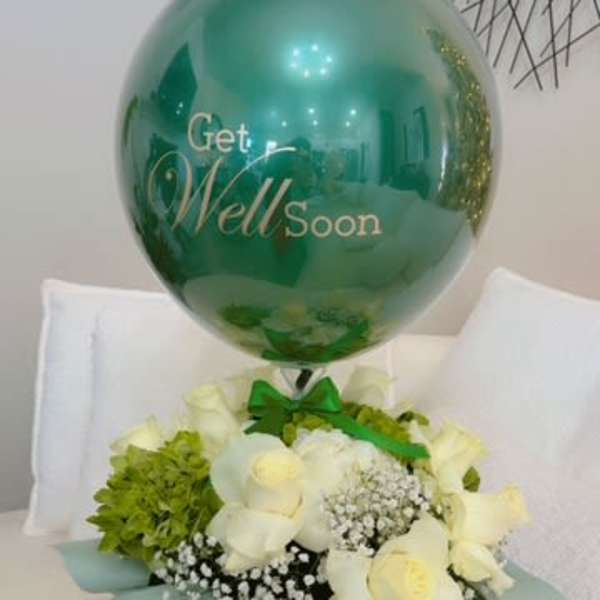 White roses and green hydrangea with a teal get well soon balloon