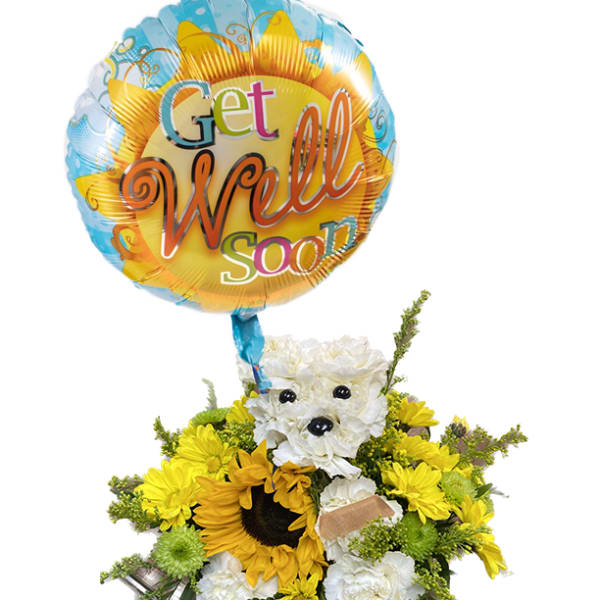 Yellow and white flower arrangement with a "Get Well Soon" balloon and teddy bear face