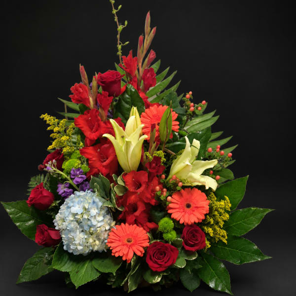 Mixed bouquet with red roses, lilies, gerbera daisies, and hydrangea