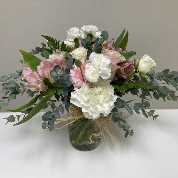 Pink and white mixed bouquet in a glass vase
