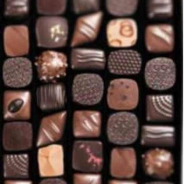 Assorted chocolates in a box with varied square pieces