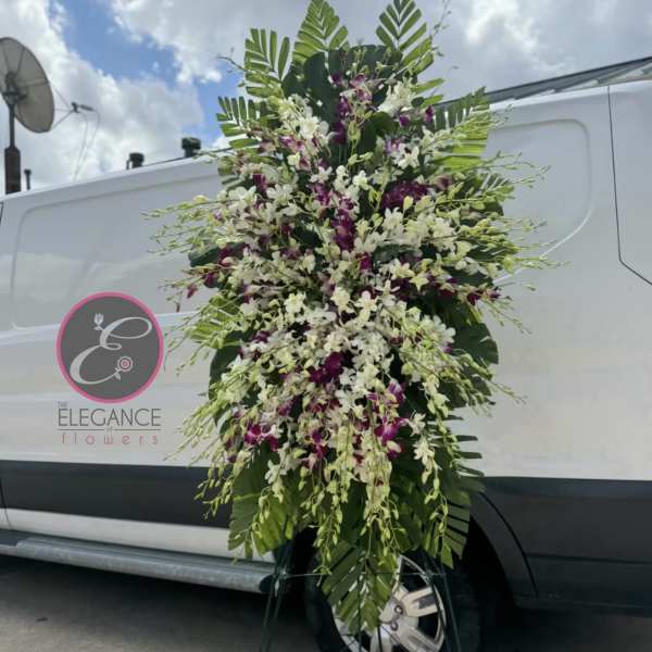 Tall standing floral spray with white and purple orchids