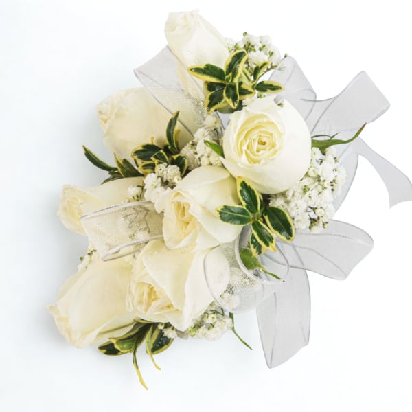 Bouquet of white roses with white ribbon and small white filler flowers