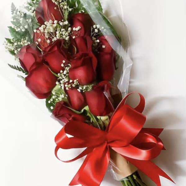 Bouquet of red roses with baby's breath and a red ribbon