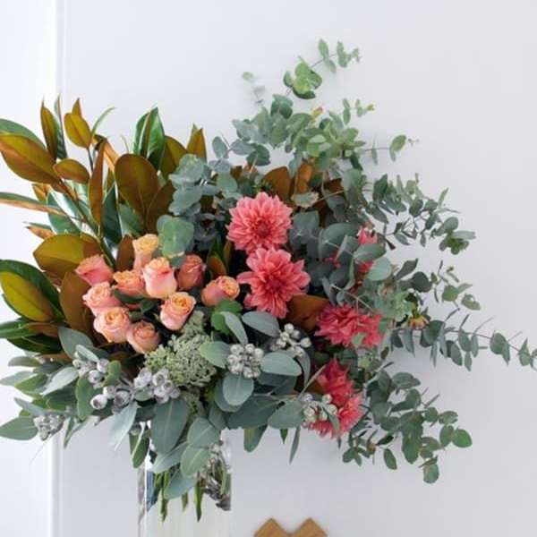Pink and peach bouquet in a clear glass vase