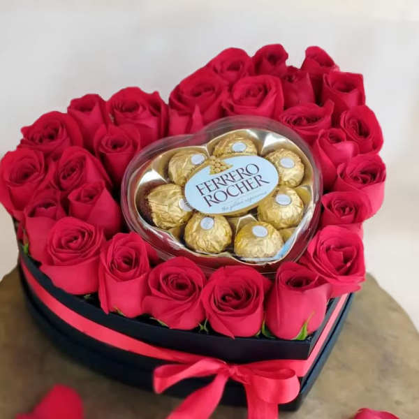 Heart-shaped box of red roses with Ferrero Rocher chocolates in the center